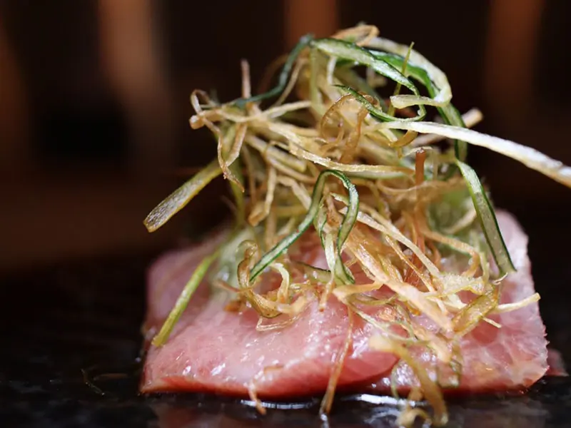 Seared tuna tataki with crispy scallion at Umami Crudo , a Japanese Restaurant in Boston